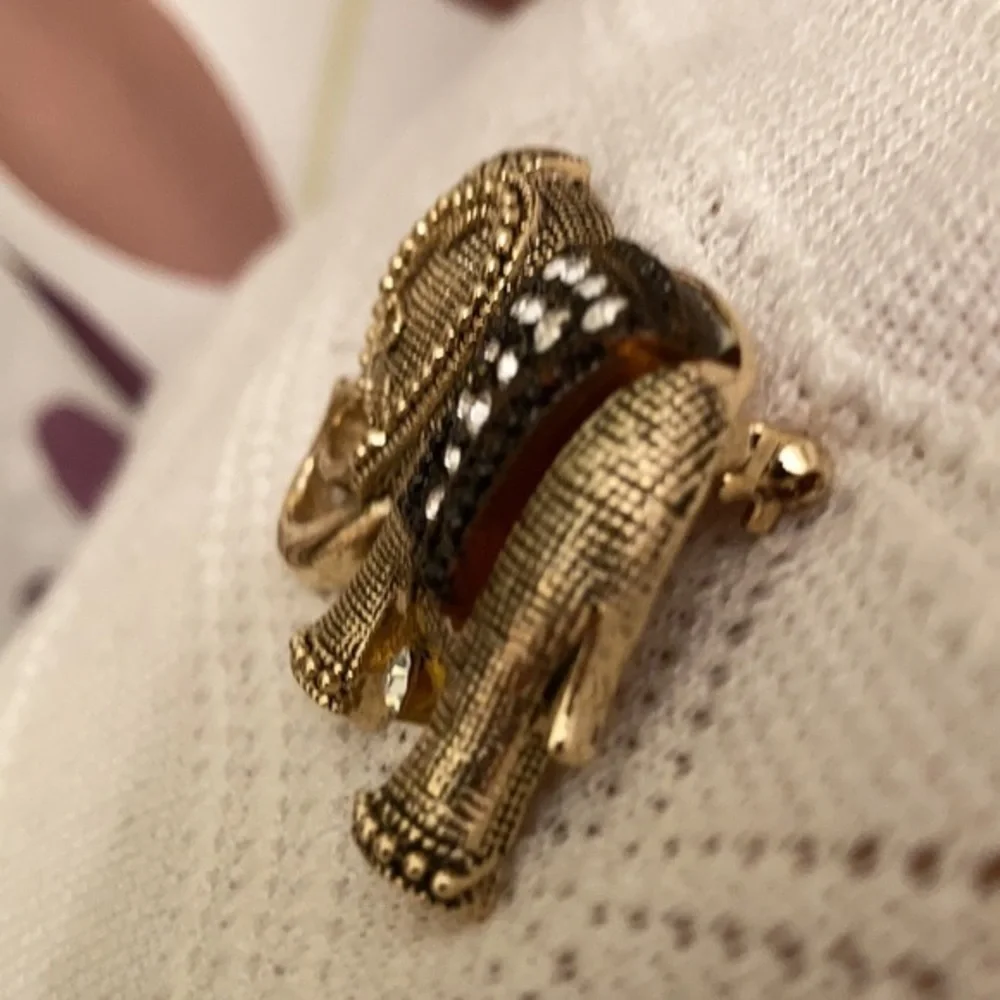 Gorgeous gold tone and crystal elephant brooch
